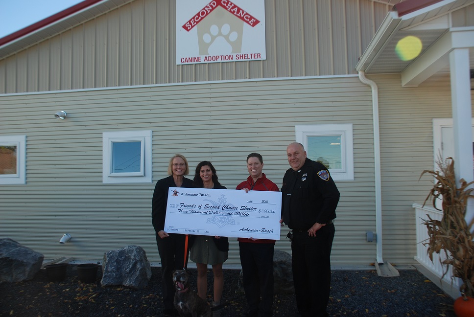 (L to R): County Executive Joanie Mahoney, President of The Friends of Second Chance Canine Adoption Shelter Board Kim Smith-Ford, Anheuser-Busch General Manager Bryan Sullivan, Corrections Officer Al Henson and new resident Trixie.