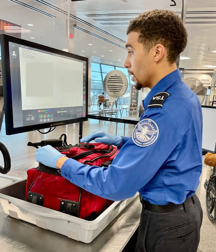 Bag check at SYR checkpoint